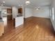 Open living room and kitchen with hardwood floors and modern features at 1805 Palazzo Dr, Waxhaw, NC 28173