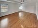Main bedroom features hardwood floors, tray ceiling, and natural light at 1805 Palazzo Dr, Waxhaw, NC 28173