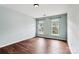 Bedroom with two windows providing ample light and dark wood floors at 1836 Danny Ct, Matthews, NC 28105