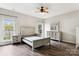 This bedroom features a neutral color palette, wood floors, and coordinating bedroom set at 1836 Danny Ct, Matthews, NC 28105