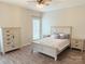 Bedroom featuring a full furniture set, ceiling fan, and natural light, creating a comfortable and relaxing space at 1836 Danny Ct, Matthews, NC 28105