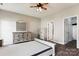 This bedroom features a neutral color palette, wood floors, closet and adjoining bath at 1836 Danny Ct, Matthews, NC 28105