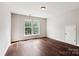 Bedroom with two windows providing ample light and a closet at 1836 Danny Ct, Matthews, NC 28105
