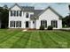 Traditional two-story home with a manicured lawn and classic black shutters at 1836 Danny Ct, Matthews, NC 28105