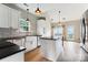 Bright kitchen featuring white cabinets, farmhouse sink, and stainless steel appliances at 1836 Danny Ct, Matthews, NC 28105