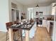 Modern kitchen with stainless steel appliances, island, and breakfast bar seating at 1836 Danny Ct, Matthews, NC 28105