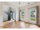Sunlit living room with hardwood floors, high ceilings, and large windows overlooking the front yard at 1836 Danny Ct, Matthews, NC 28105