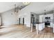 Spacious open floor plan with hardwood floors, high ceilings, and a modern kitchen at 1836 Danny Ct, Matthews, NC 28105