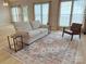 Living room featuring tile floors, an area rug, and natural light at 1836 Danny Ct, Matthews, NC 28105
