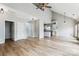 Large open concept living area featuring hardwood floors, natural light, and access to the kitchen at 1836 Danny Ct, Matthews, NC 28105