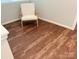 Bright room with chair and hardwood flooring at 1836 Danny Ct, Matthews, NC 28105