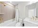 Bright bathroom with a combined shower and tub, white vanity, and gold fixtures for a luxurious feel at 1925 Dunavant St, Charlotte, NC 28203