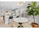 Bright, open kitchen with white cabinets, a center island, and a cozy dining area at 1925 Dunavant St, Charlotte, NC 28203