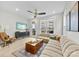 Spacious living room with modern decor, large sectional sofa, and balcony access overlooking the neighborhood at 1925 Dunavant St, Charlotte, NC 28203