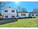 Charming two-story home features a well-manicured lawn and classic blue shutters at 2007 Nw Candlewood Nw Dr, Concord, NC 28027