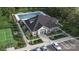 Aerial view showcasing the pool, tennis court and clubhouse in a beautifully landscaped community at 2323 Riggs Rd, Sherrills Ford, NC 28673