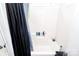 Bathroom featuring shower and tub with black shower curtain at 307 W Mcneely Ave, Mooresville, NC 28115
