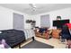 Bedroom features a ceiling fan, window, tv, and dark carpet at 307 W Mcneely Ave, Mooresville, NC 28115