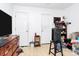 Bedroom with neutral walls, ceiling fan, closet, and two entry doors at 307 W Mcneely Ave, Mooresville, NC 28115
