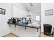Bright kitchen features white cabinets and countertop bar with dark countertop at 307 W Mcneely Ave, Mooresville, NC 28115