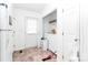 Laundry area with washer, dryer, door to the exterior, and tile flooring at 307 W Mcneely Ave, Mooresville, NC 28115
