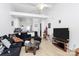 Bright living room boasts an open floor plan, vaulted ceilings, and sleek hardwood floors at 307 W Mcneely Ave, Mooresville, NC 28115