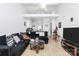 Bright living room boasts an open floor plan, vaulted ceilings, and sleek hardwood floors at 307 W Mcneely Ave, Mooresville, NC 28115