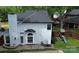 Aerial view of a fenced backyard with patio, grill, playset and turfed yard at 3516 Mill Stream Ct, Charlotte, NC 28209