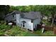 Aerial view of fenced backyard with patio, grill, playset and turfed yard at 3516 Mill Stream Ct, Charlotte, NC 28209