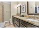 Spacious bathroom vanity featuring dual sinks, granite countertops, and decorative mirrors for a luxurious feel at 3516 Mill Stream Ct, Charlotte, NC 28209