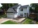 Charming two-story home features a well-maintained front yard and attached two-car garage at 3516 Mill Stream Ct, Charlotte, NC 28209