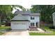 Charming home with attached garage, inviting front yard and mature trees at 3516 Mill Stream Ct, Charlotte, NC 28209