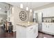 Charming kitchen featuring white cabinets, stainless steel appliances and a granite island with pendant lighting at 3516 Mill Stream Ct, Charlotte, NC 28209