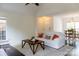 Bright living room featuring hardwood floors, neutral decor, and an open floor plan at 3516 Mill Stream Ct, Charlotte, NC 28209