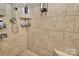 Tiled walk-in shower with built-in shelves offers a spa-like experience with modern fixtures at 3516 Mill Stream Ct, Charlotte, NC 28209