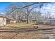 Large backyard with mature trees, a fenced area, and a shed at 515 Richards Rd, Chester, SC 29706