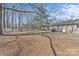 Large, partially fenced backyard with mature trees and a lawn at 515 Richards Rd, Chester, SC 29706