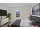 Modern bedroom features a flat screen TV, a white dresser, an indoor plant, and a gray bed at 515 Richards Rd, Chester, SC 29706