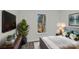 Modern bedroom features a large flat screen TV, an indoor plant, and a bed with a lamp on a bedside table at 515 Richards Rd, Chester, SC 29706