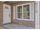 Inviting front entrance featuring a decorative glass door, window, and clear address numbers at 515 Richards Rd, Chester, SC 29706
