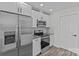 Well-equipped kitchen with stainless steel fridge, modern range, and bright white cabinetry at 515 Richards Rd, Chester, SC 29706