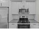 Stylish kitchen with stainless steel appliances, subway tile backsplash, and modern white cabinets at 515 Richards Rd, Chester, SC 29706