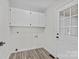 Laundry room features white cabinets above a washer and dryer hookup and an exterior door at 515 Richards Rd, Chester, SC 29706
