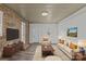 Cozy living room with exposed brick wall, wood ceiling, and stylish furnishings at 515 Richards Rd, Chester, SC 29706