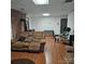 Finished basement features laminate flooring, brick wall, and entertainment area with exercise equipment at 5516 Northwood Dr, Hickory, NC 28601