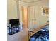 Bedroom featuring a TV, bed, and an open door at 5516 Northwood Dr, Hickory, NC 28601