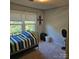 Cozy bedroom with large window and poster at 5516 Northwood Dr, Hickory, NC 28601
