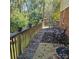 Wooden deck features outdoor seating, potted plants, and natural surroundings at 5516 Northwood Dr, Hickory, NC 28601