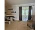Bright dining room area with a wooden table and a tan chair near the window at 5516 Northwood Dr, Hickory, NC 28601