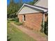 Brick house with tan siding, visible window, and brick walkway at 5516 Northwood Dr, Hickory, NC 28601